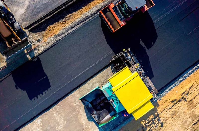 Top down of machinery construction a road.